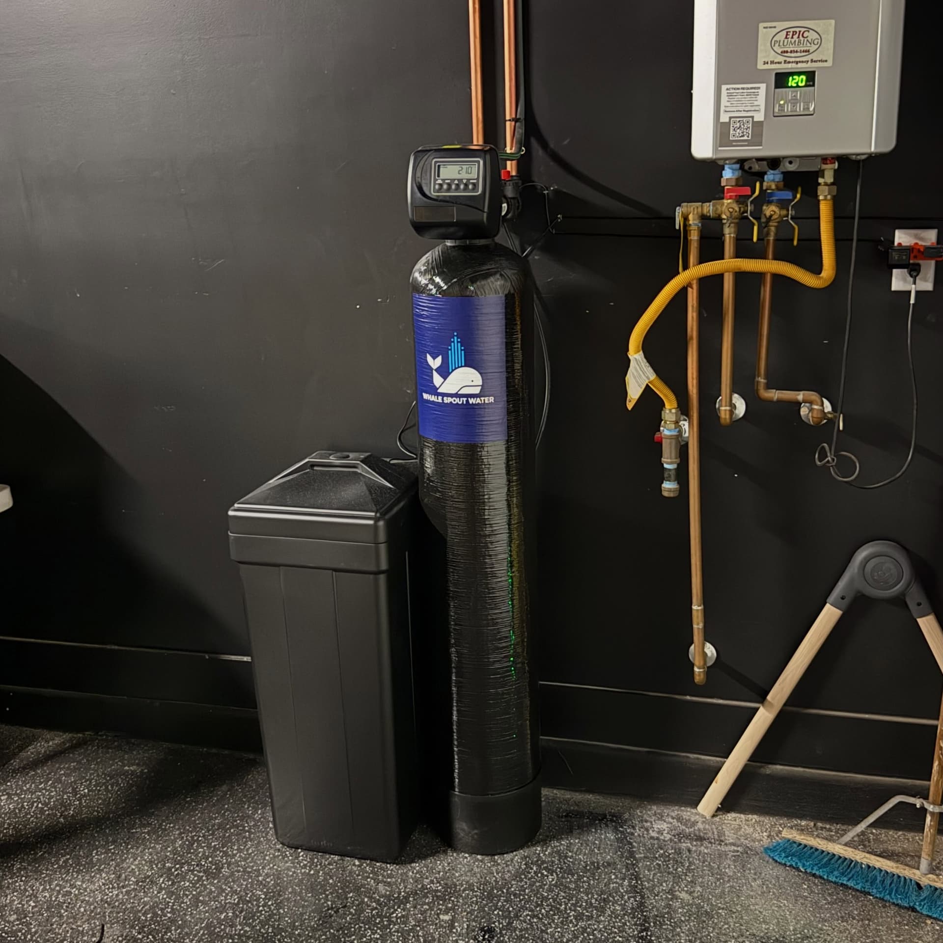 Whale Spout Water branded water softener installed in a Phoenix home utility room